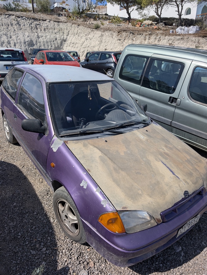 A photo of a deteriorated car
